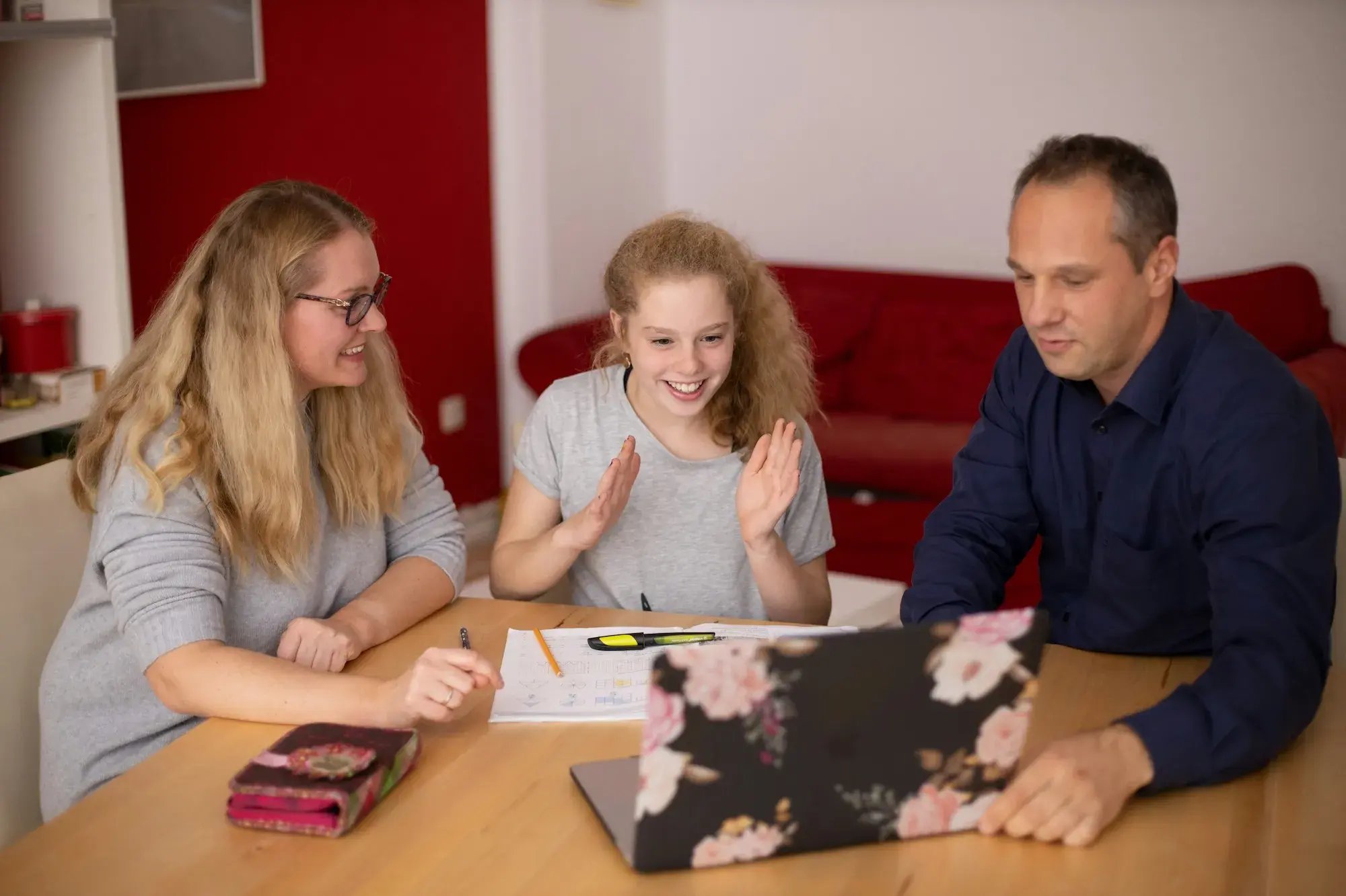 Parents with child doing homework