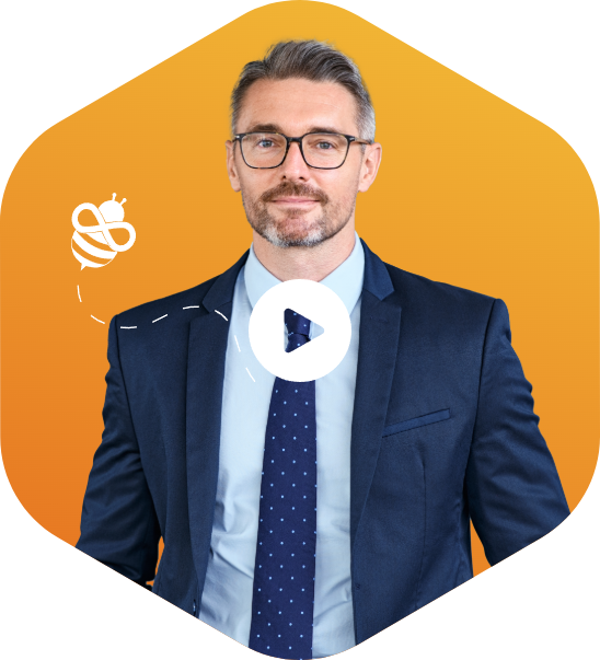 Confident professional man in suit with play button and Saasyan bee icon on orange hexagon background