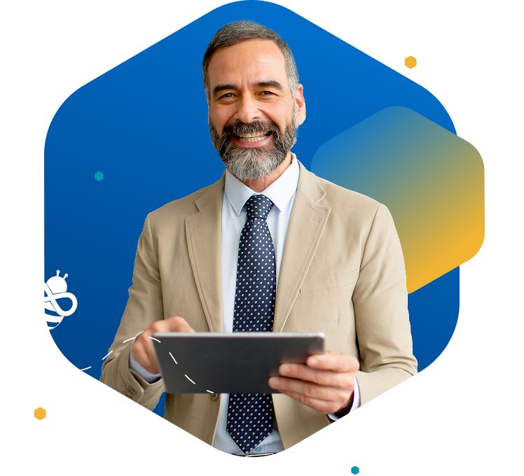 Smiling man in tan suit holding a tablet on blue background with bee icon in the left side