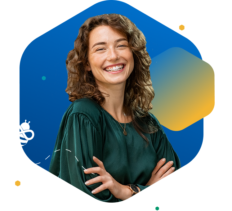 Smiling woman with wavy brown hair in green top facing right, in front of blue background